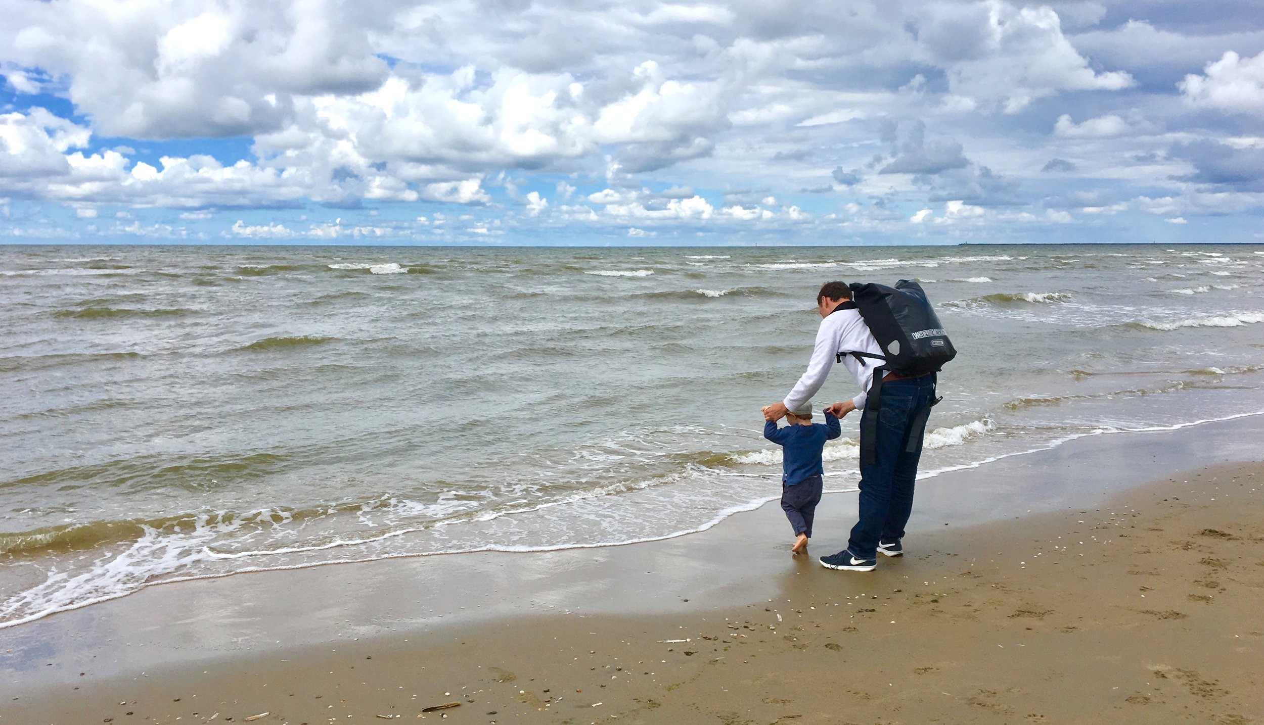 A lovely shot of Andreas and one of his children at the beach