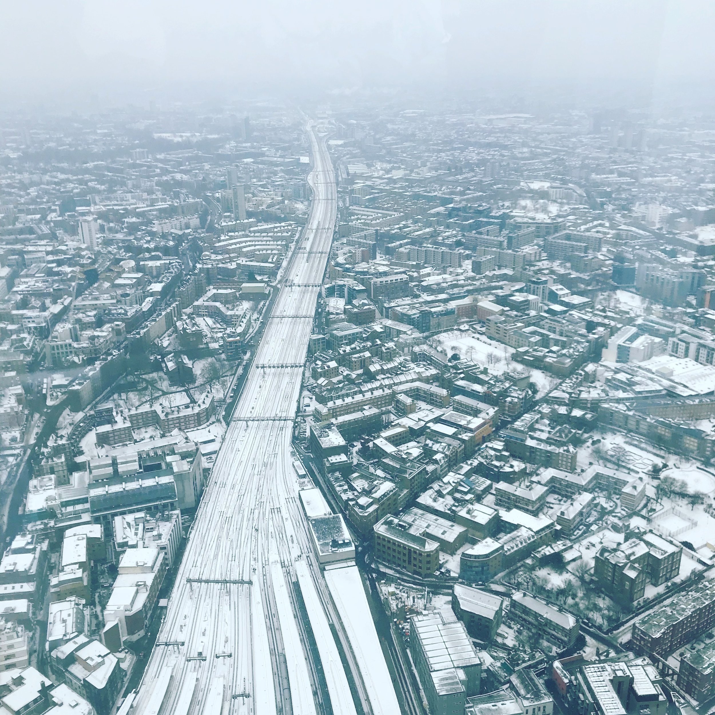  An aerial view shot of the snowy city from the Shard 