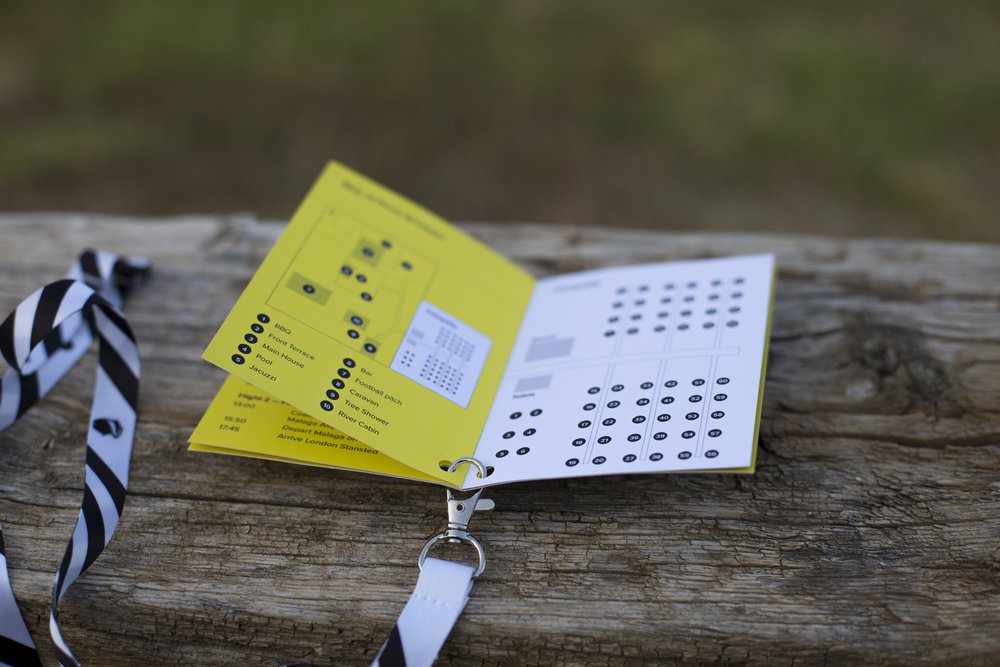 The opened schedule booklet with a map and key very festival styled